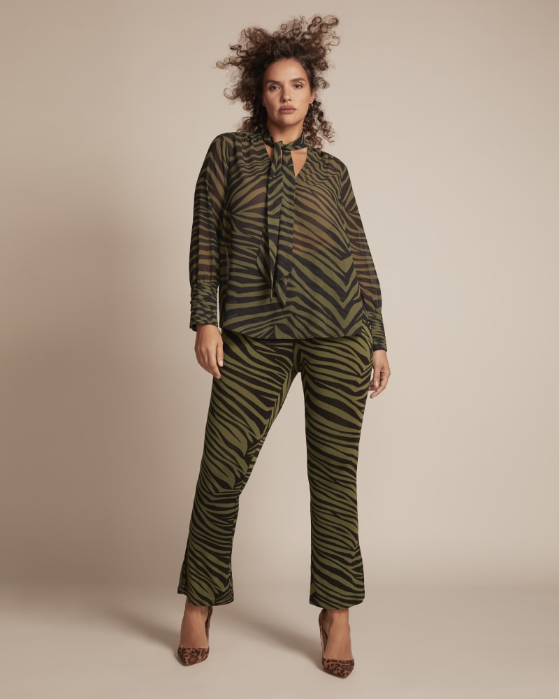 Front of a model wearing a size 1 Jade Flare Legging in Olive Green / Black by 11 Honoré Collection. | dia_product_style_image_id:246279